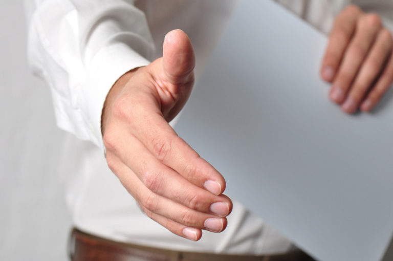 close up of an open handshake