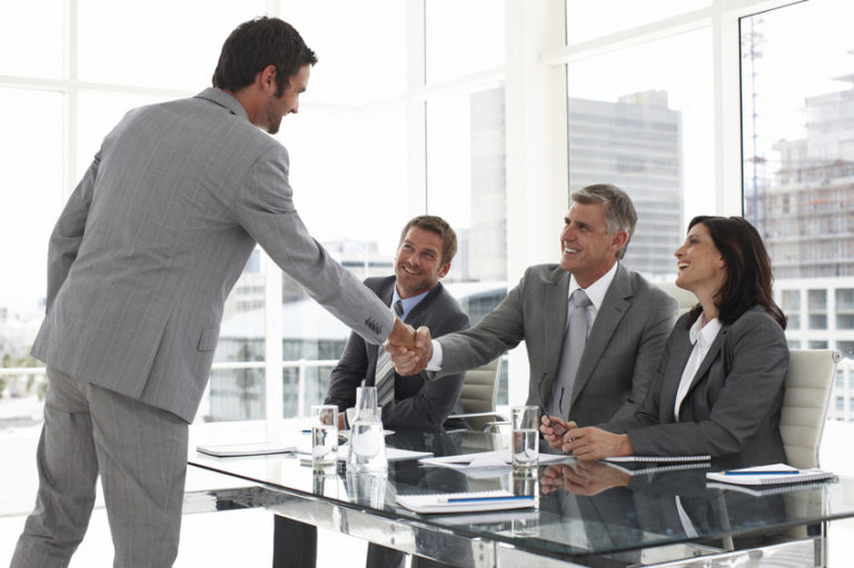 interview and businessmen shaking hands