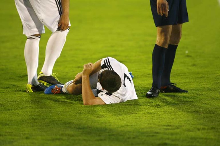 Soccer Player on the Ground