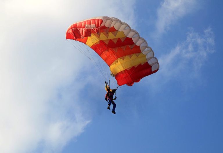 person landing with a parachute