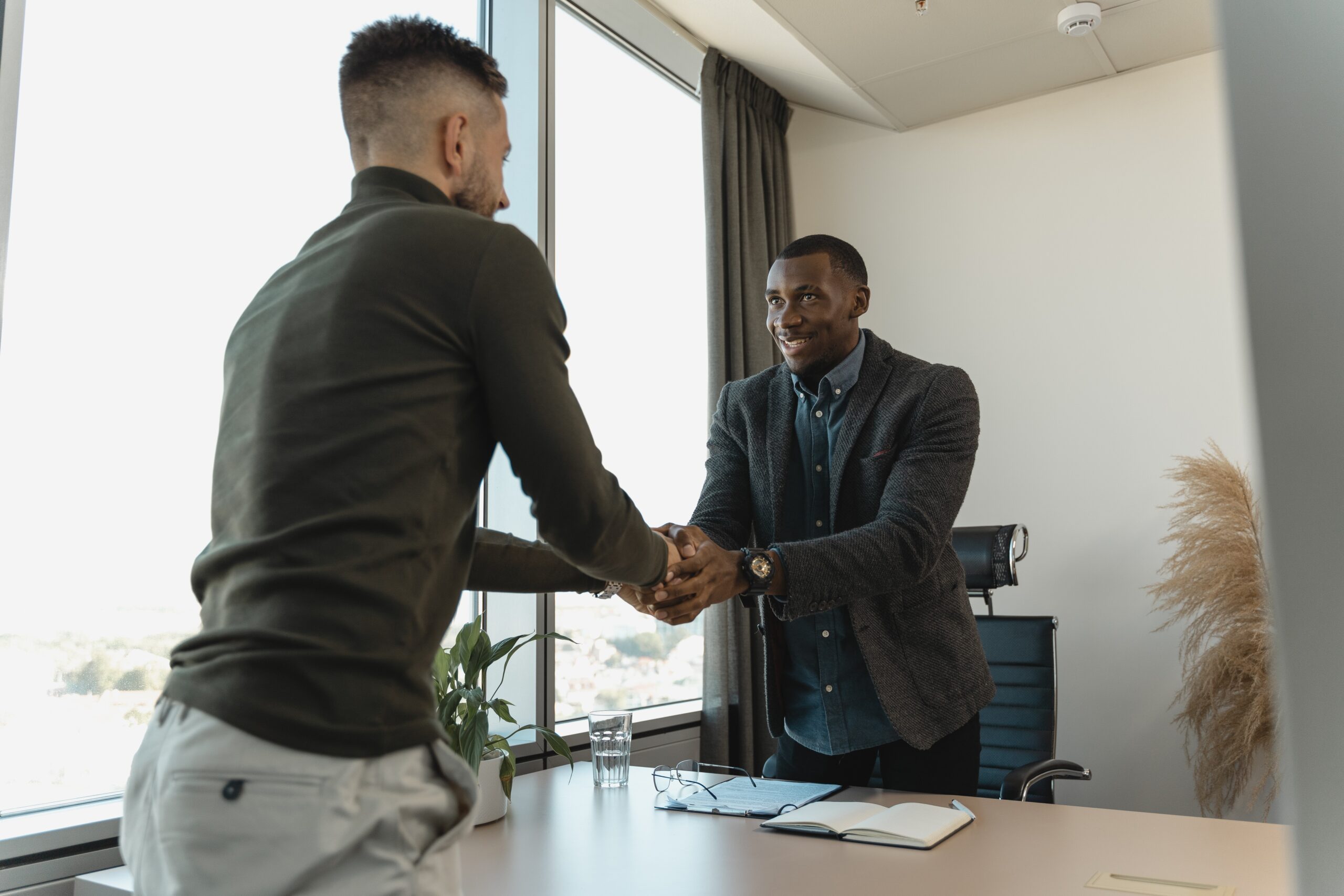 Hiring manager shaking candidates hand